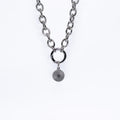 Circle Small Charm, detail view - tarnish-free stainless steel by House of Rey Jewelry