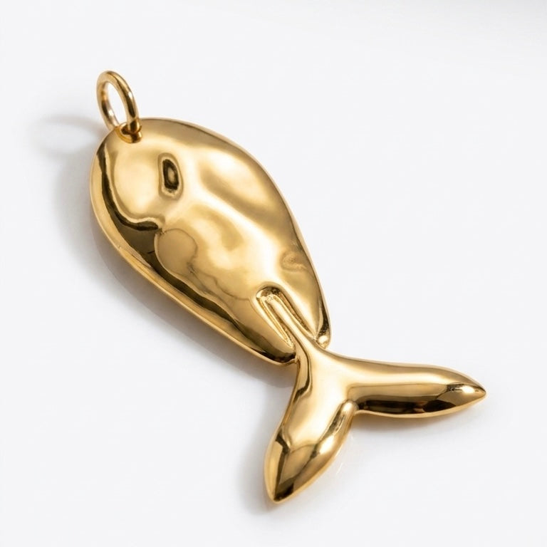 A polished gold fish pendant with a small hanging loop at the top, shown on a clean white background.